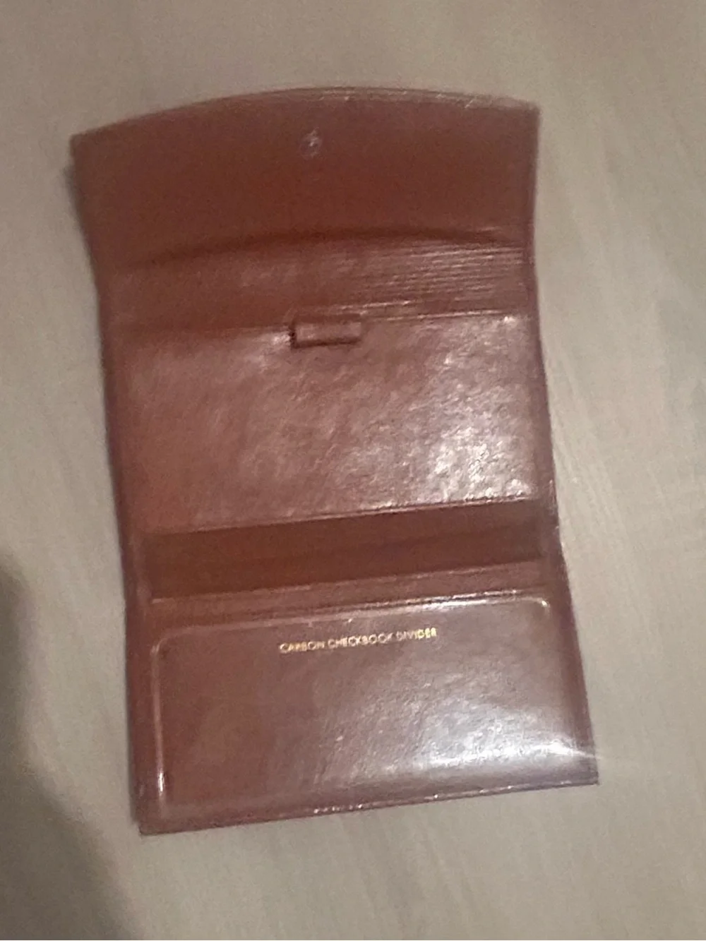 Rolfs brown leather card case with gold detail